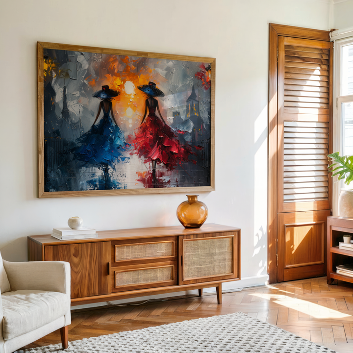 Modern canvas wall art showing two elegant women in flowing red and blue dresses walking in a dramatic city scene