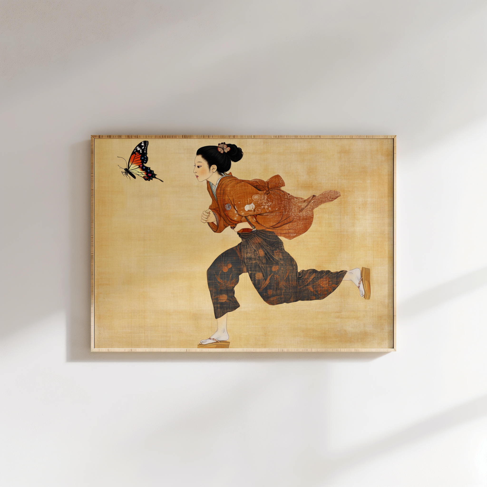 Framed artwork of a woman in traditional attire with a butterfly on a beige background