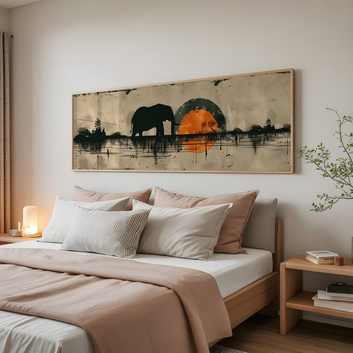 Modern wildlife wall art featuring a black elephant silhouette against a textured sunset landscape