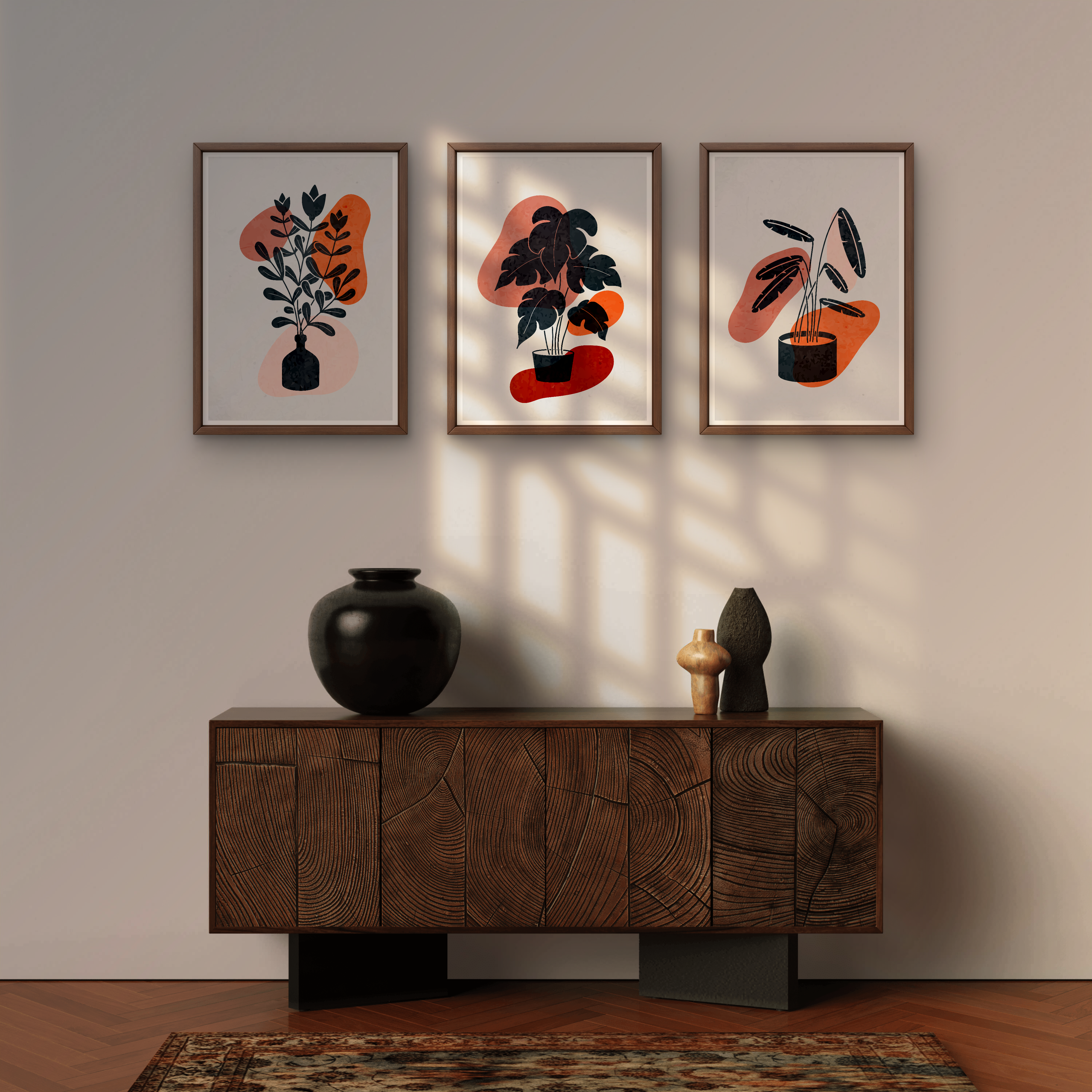 Three framed abstract plant artworks above a wooden cabinet with decorative vases.