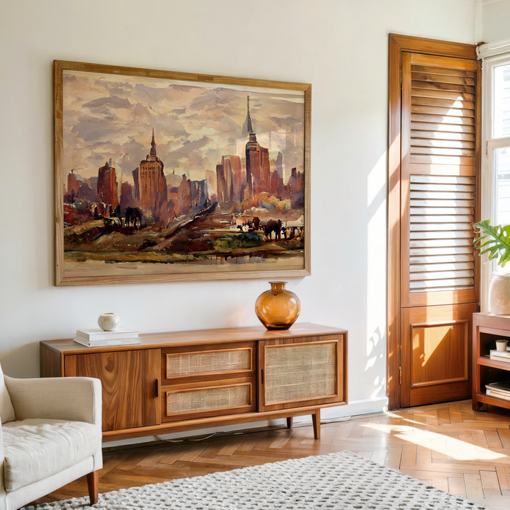 Indian man sitting with framed New York wall art in background