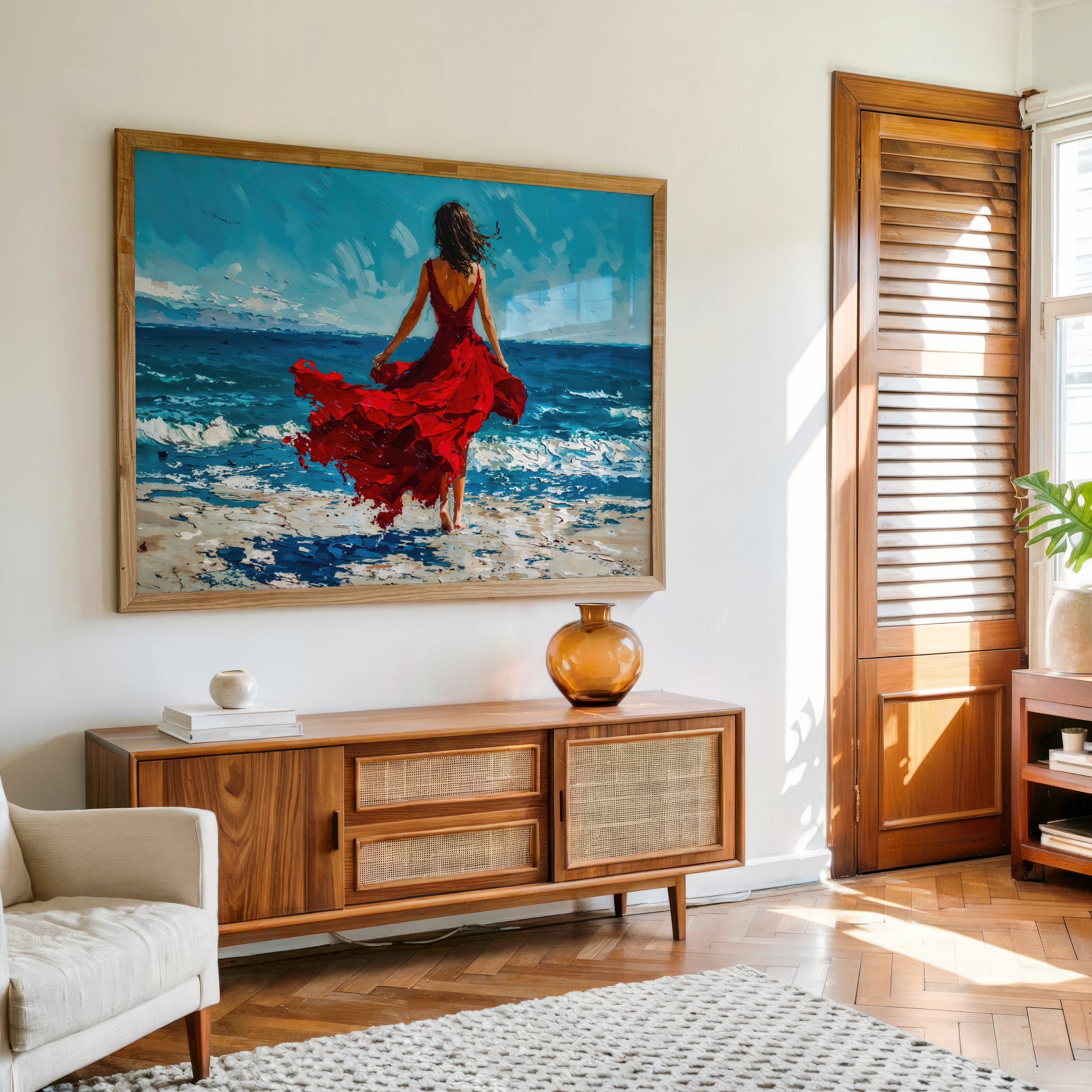 Living room with a large painting of a woman in a red dress by the ocean, wooden sideboard, and armchair.